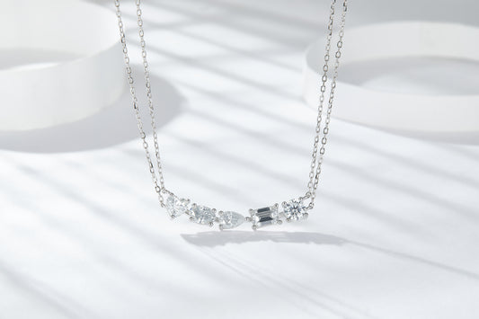 moissanite diamond pendant in sterling silver featuring intricate sparkling gems and elegant chain design.