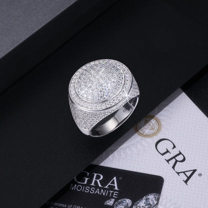 Moissanite hip-hop ring laid out on jewelry display surface